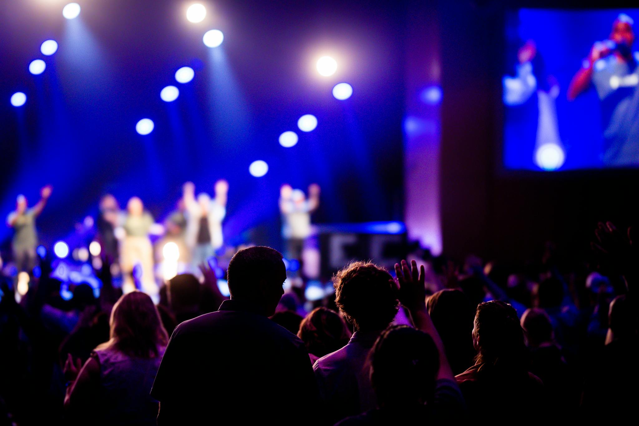 Building a Loyal Blog Audience: Strategies for Engagement and Growth Energetic concert crowd with vibrant lighting at a live music event, creating a lively atmosphere.