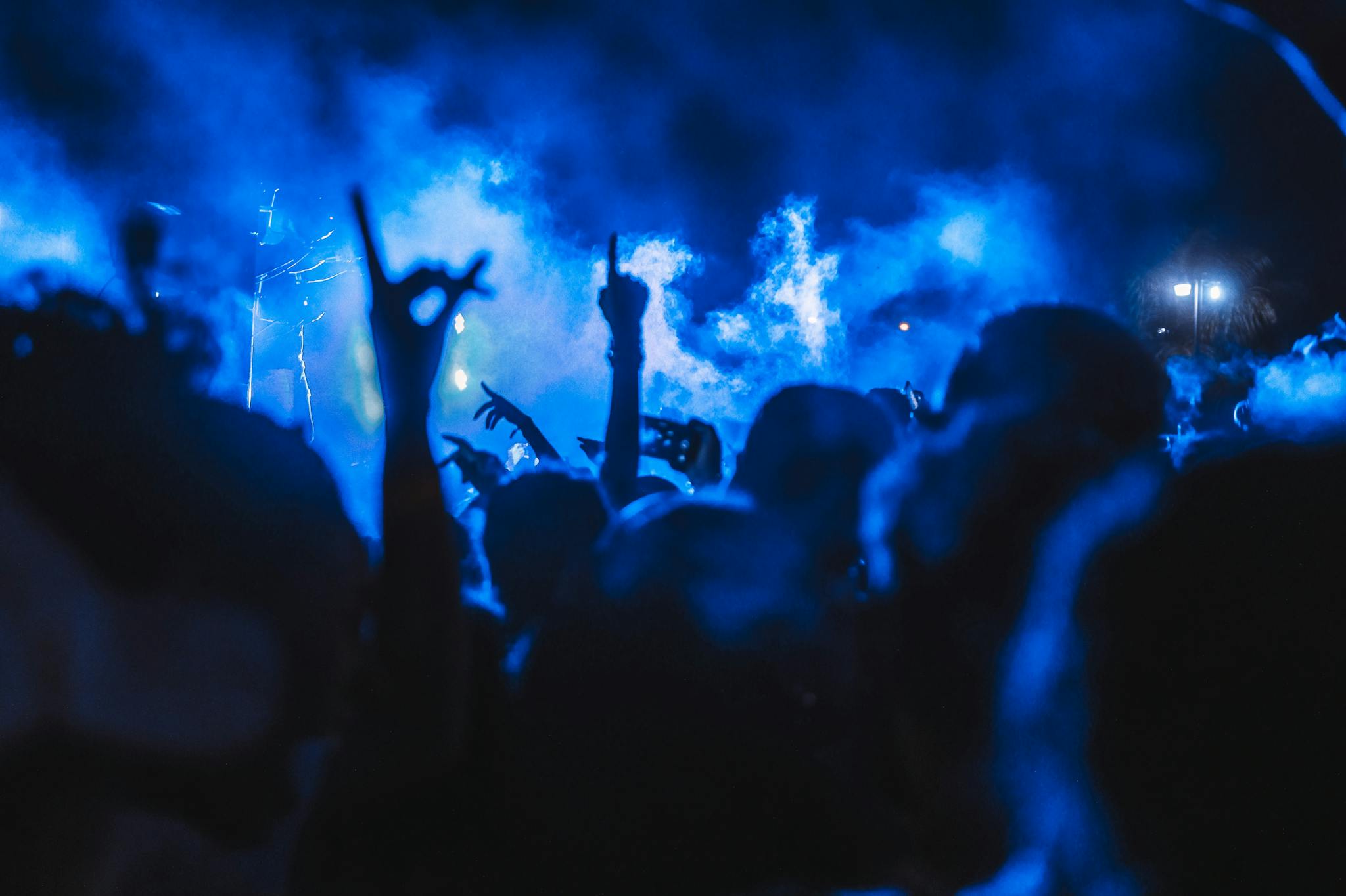 Effective Blog Promotion: Strategies to Increase Your Reach Vibrant crowd enjoying a live concert at night with stunning smoke effects creating a dynamic atmosphere.